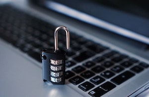 Close Up of a Combination Lock on a Laptop