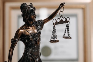 Orange County California Criminal Attorney Close Up of a Bronze Lady Justice Statue